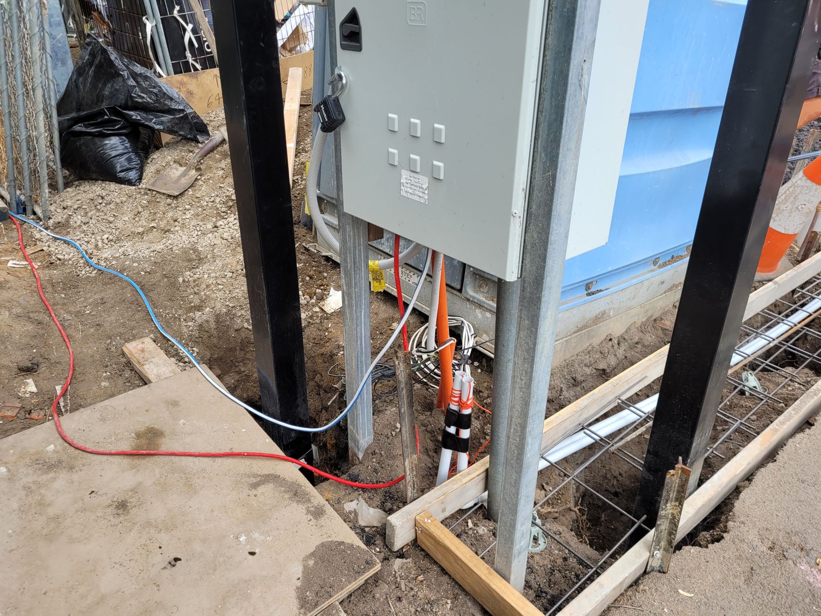 Meter pillar and conduits laid in the driveway formwork before the pour