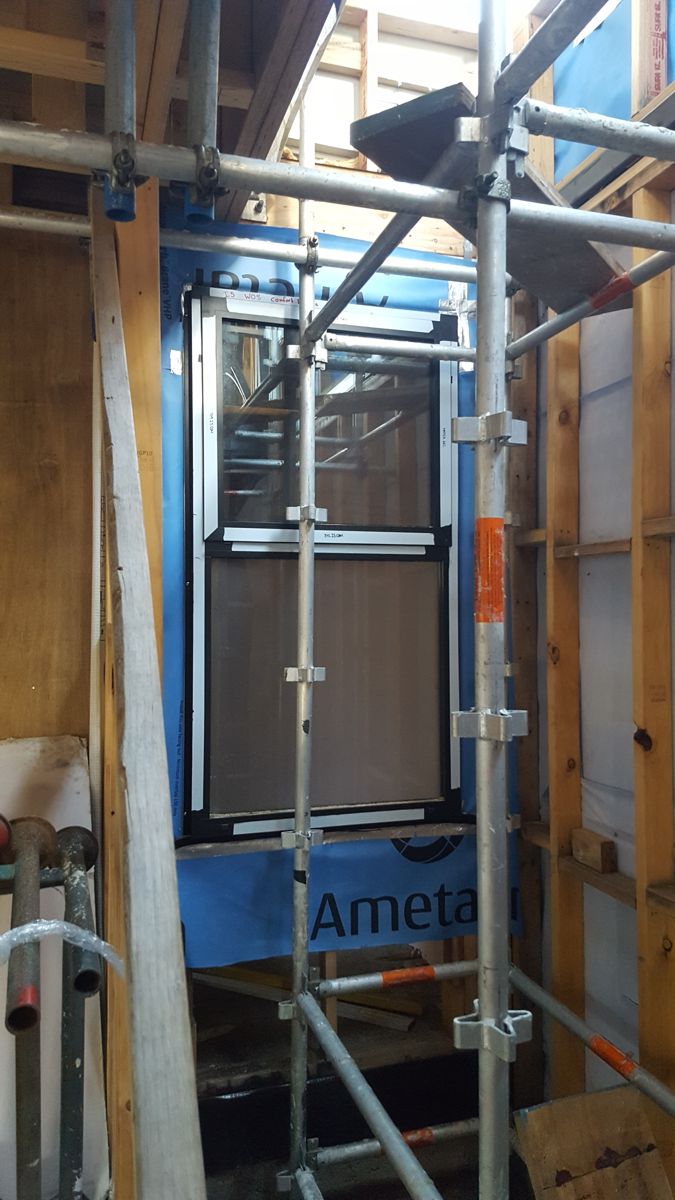 Window fitted and sealed against the external wall wrap